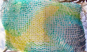 Recycled Plastic Bottles Partially Filled with Colored Water Used to Create a Parking Canopy Recycled Plastic Bottles Partially Filled with Colored Water Used to Create a Parking Canopy