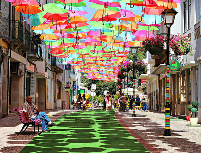 Colorful Floating Umbrellas Above a Street in Agueda, Portugal