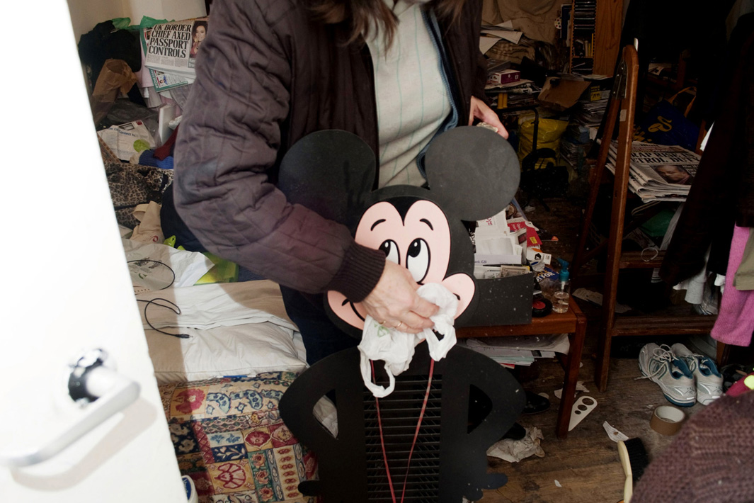 Cleaning objects rescued from the basement, London.