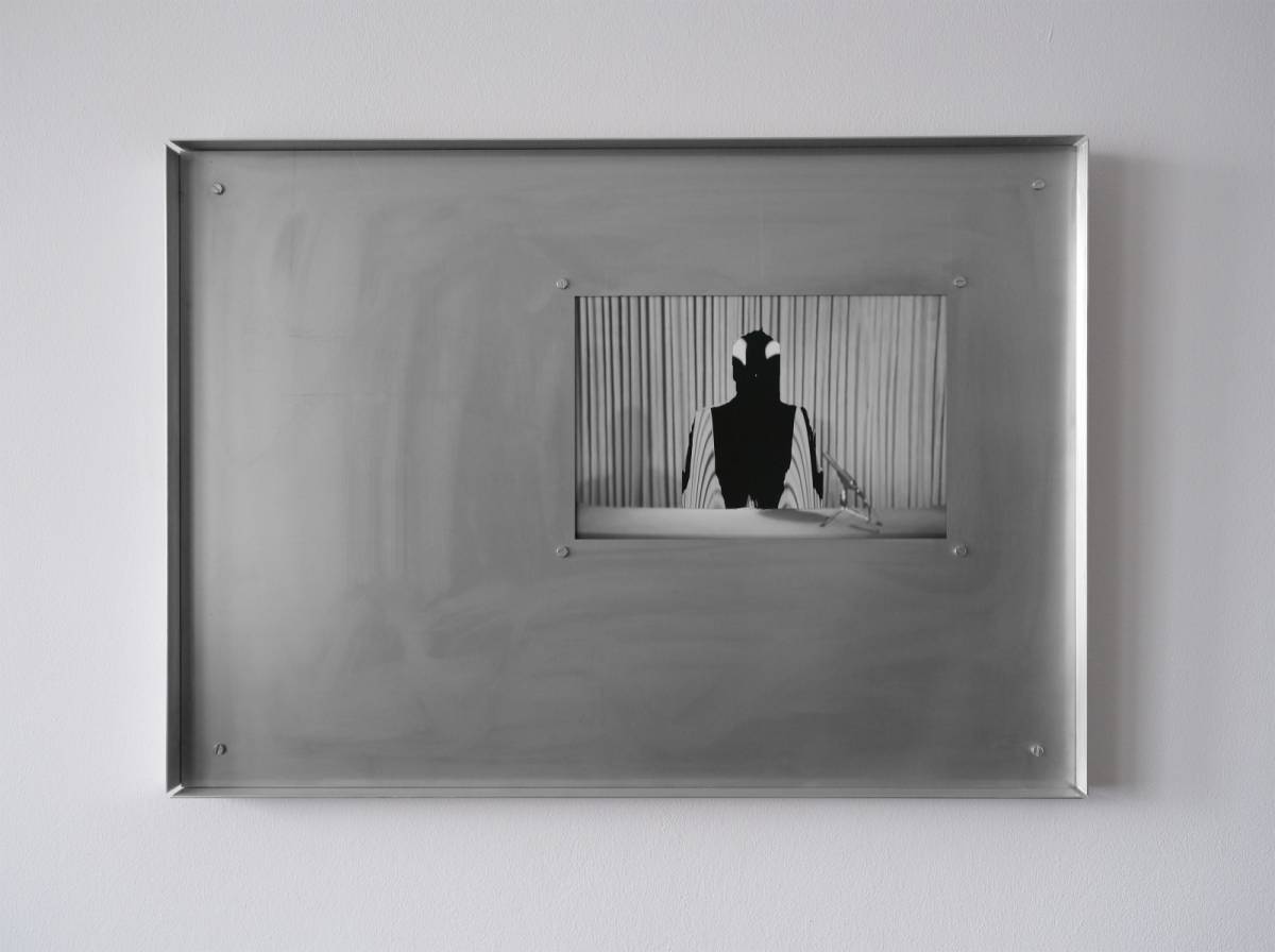 Michele Bressan, Omul_negru_2 (No Sleep - Self#4), 2026, custom-made full inox metal frame, pigment print on Hahnemühle 300g baryta paper, UV-treated glass, 50 x 70 x 4 cm, courtesy of Mobius Gallery